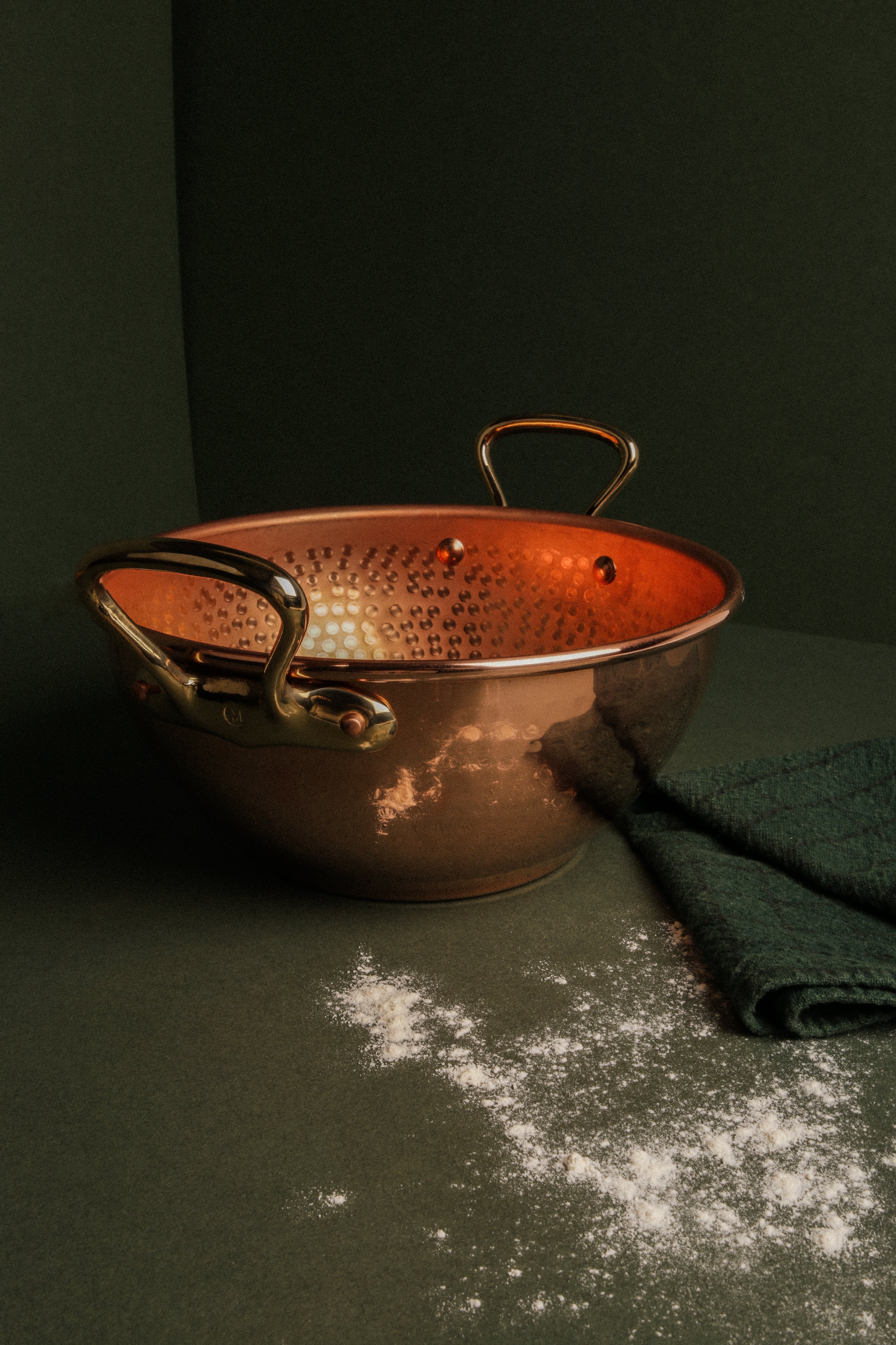 Mauviel M'PASSION copper syrup pan with brass handles, specialty cookware for precise syrup making, on a kitchen countertop.