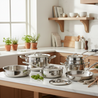 Mauviel M'URBAN 4 Tri-Ply 12-piece cookware set with stainless steel handles, including pots and pans for versatile cooking.