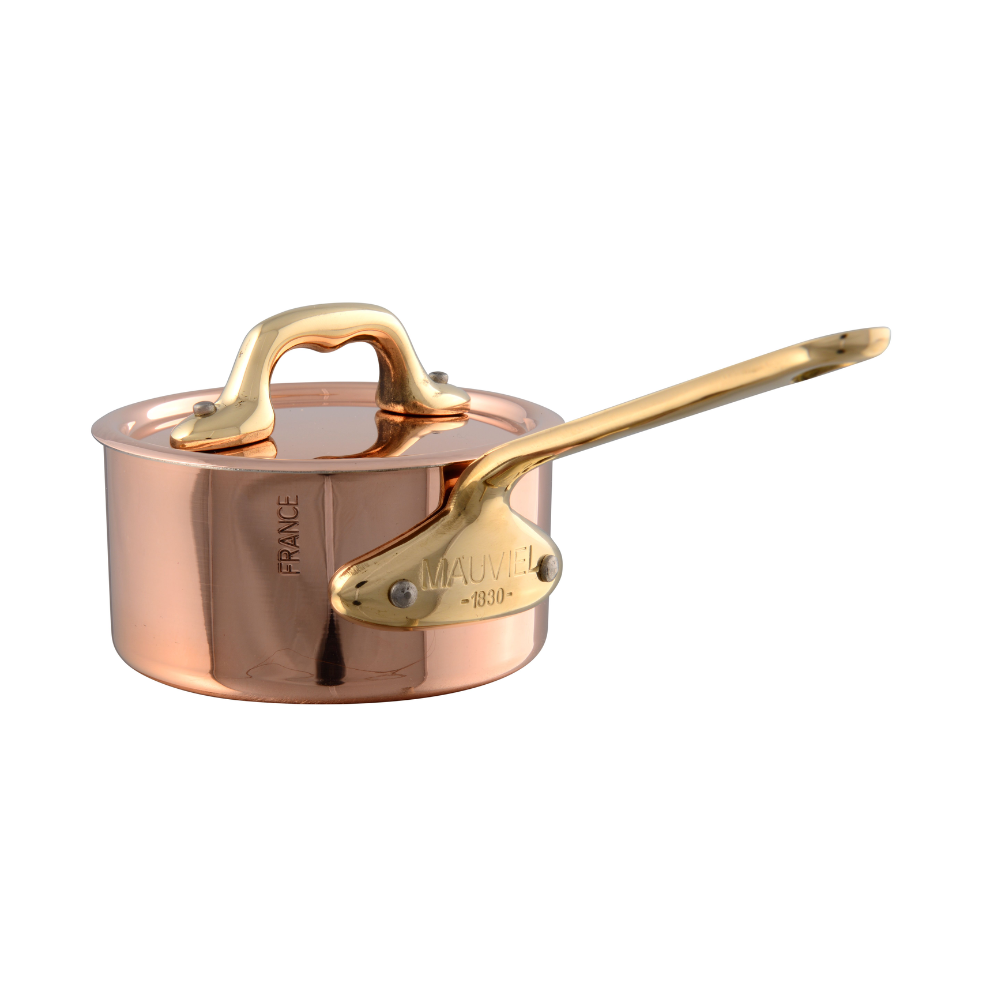 Mauviel M'MINIS copper sauce pan with brass handles and lid, 3.54-inch size, showcasing polished copper exterior and sturdy construction.