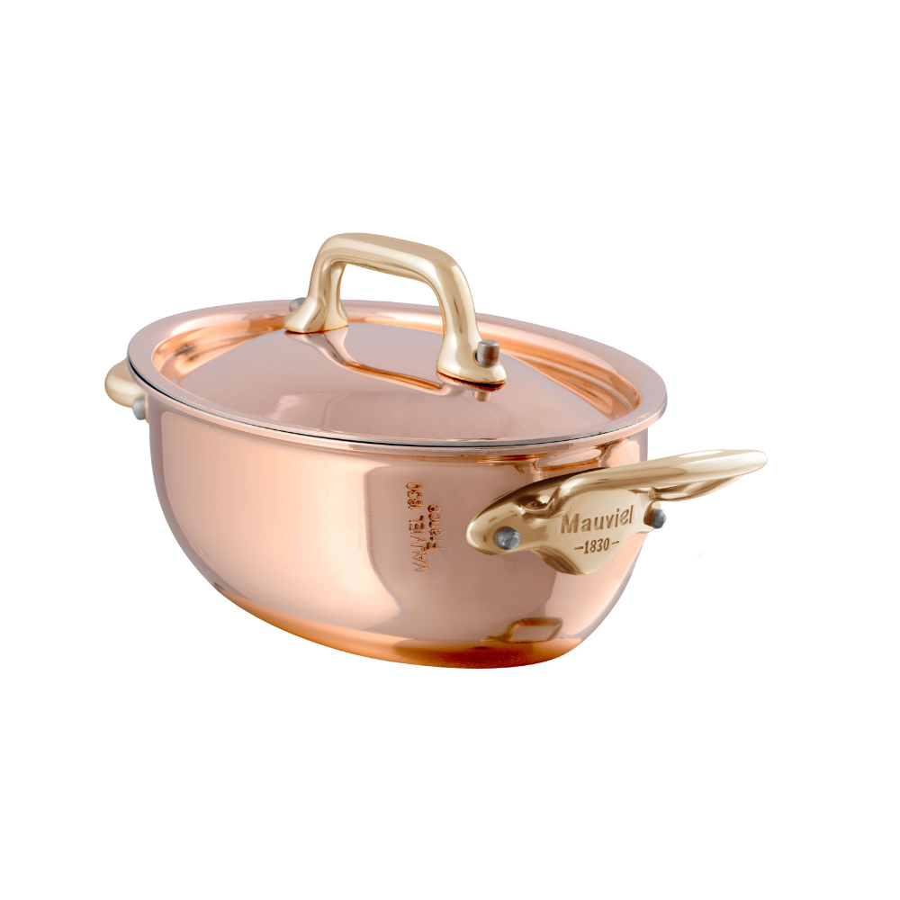 Mauviel M'MINIS copper oval stew pan with brass handles and lid, 0.42-quart capacity for cooking and serving small dishes.