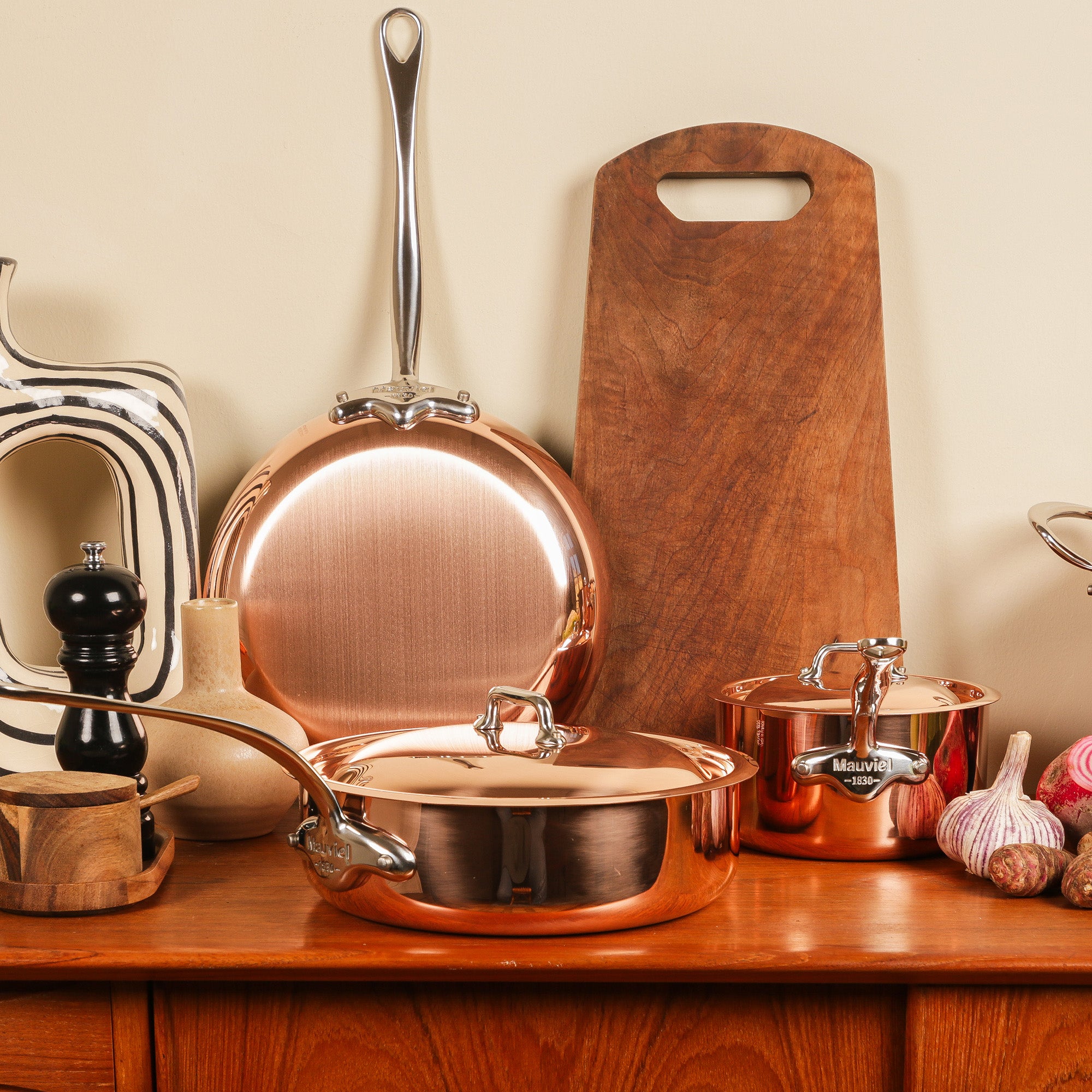 Mauviel M'Heritage M'150 S copper crepe pan with cast stainless steel handle, 11.8-inch diameter, for cooking and frying.