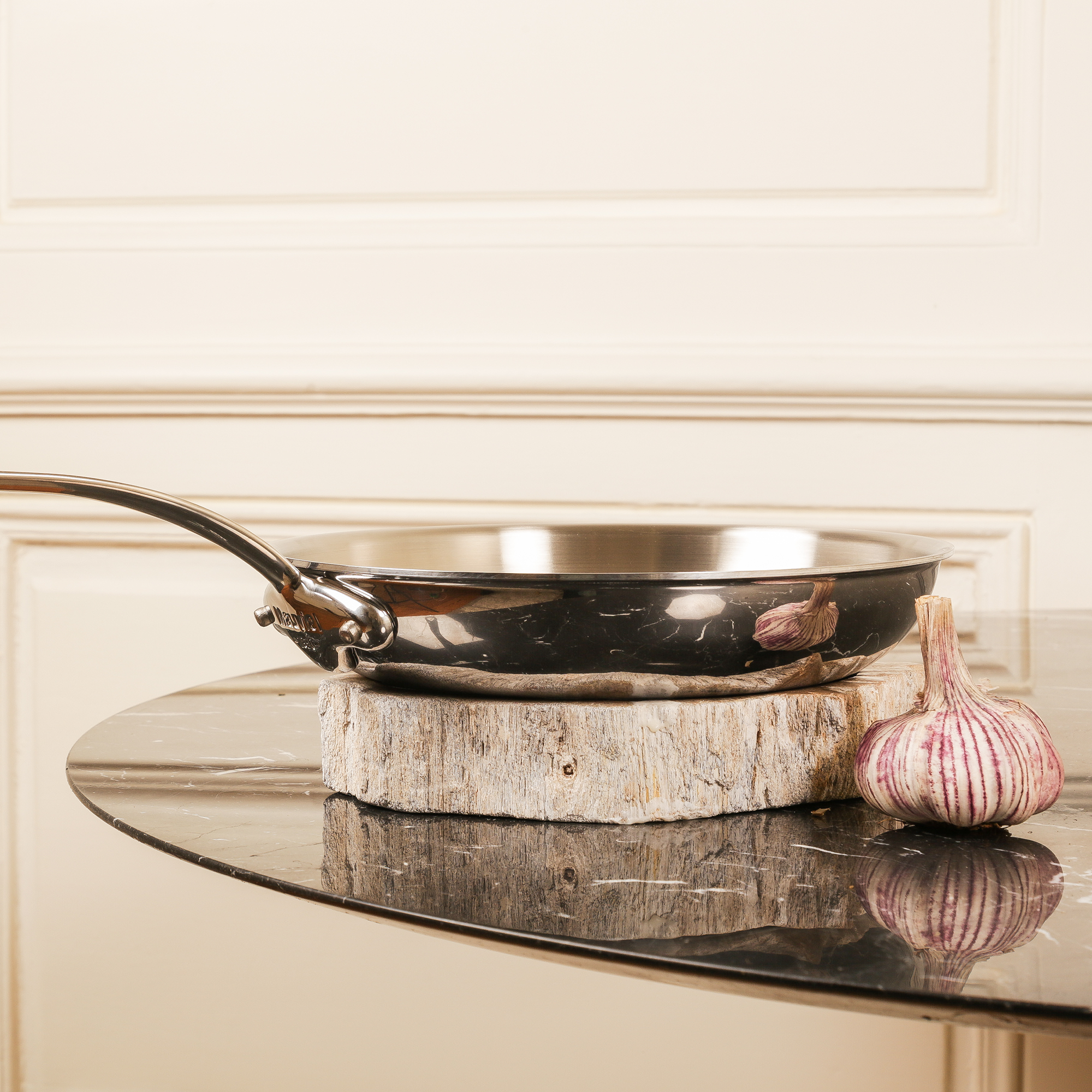 Mauviel M'COOK 11-inch 5-ply stainless steel frying pan with lid and cast stainless steel handle, suitable for versatile cooking.