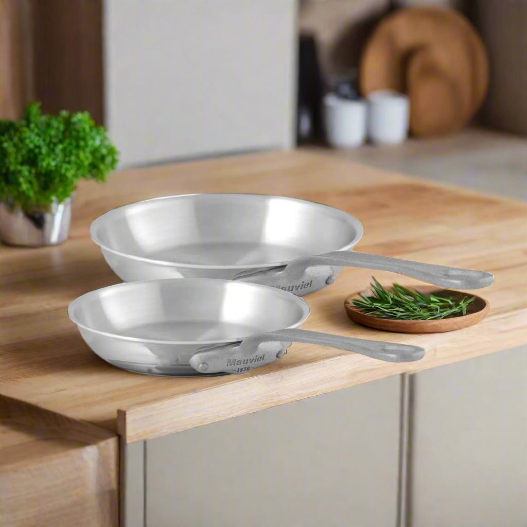 Mauviel M'Cook SB 5-Ply stainless steel frying pans with brushed cast stainless steel handles, set of two for versatile cooking.