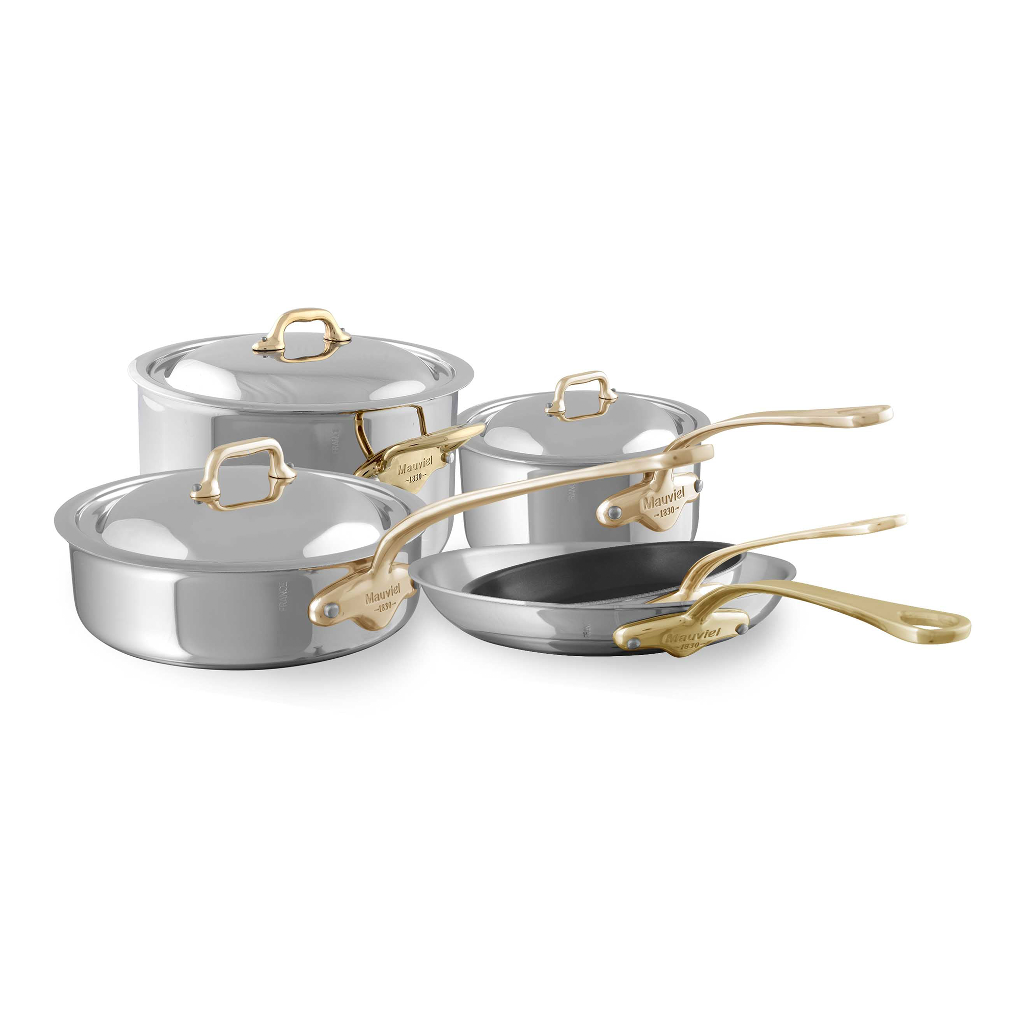 Mauviel M'COOK B 5-Ply 8-piece cookware set with brass handles, including pots and pans, arranged on a kitchen countertop.