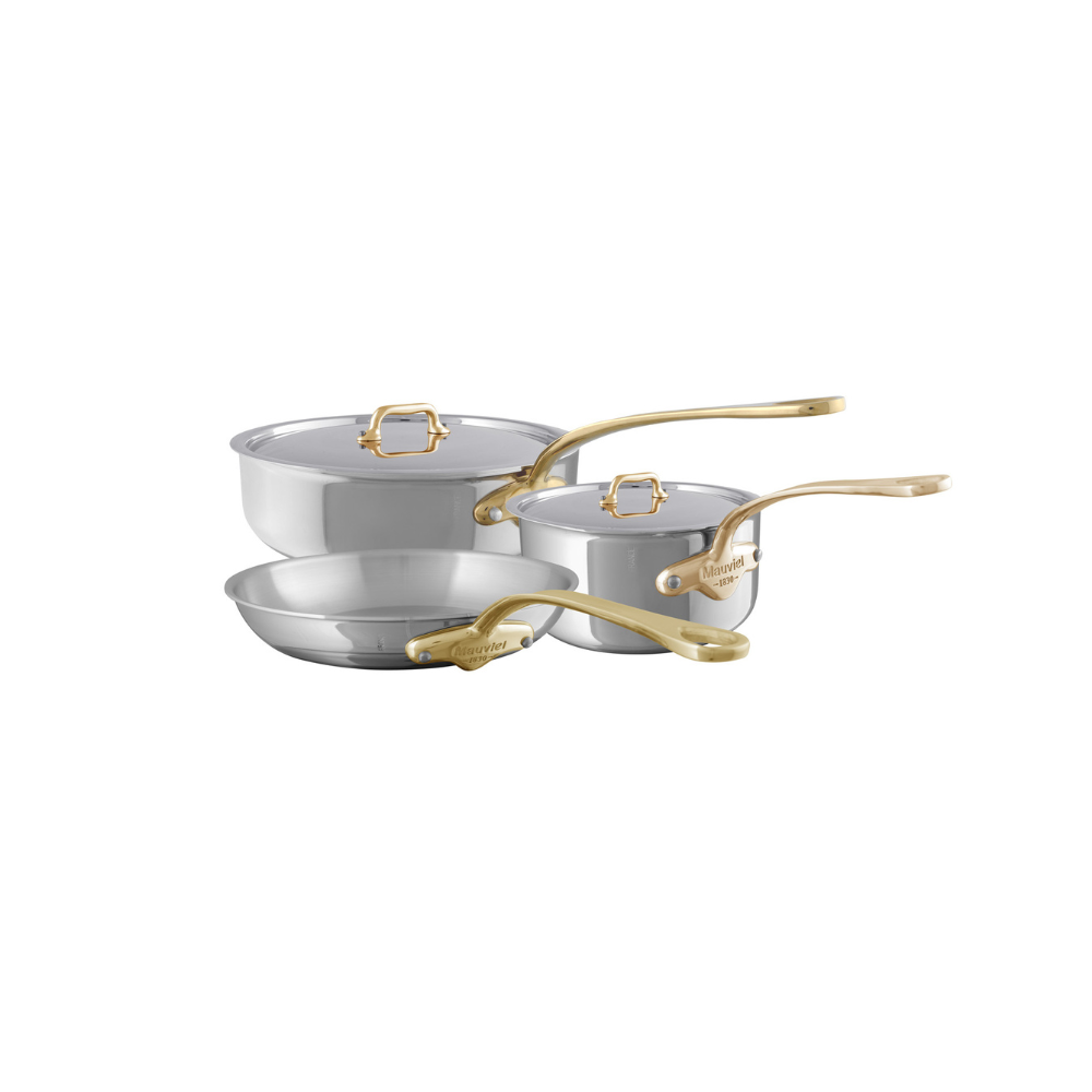 Mauviel M’COOK 5-piece cookware set with brass handles, including pots and pans, made of 5-ply stainless steel construction.