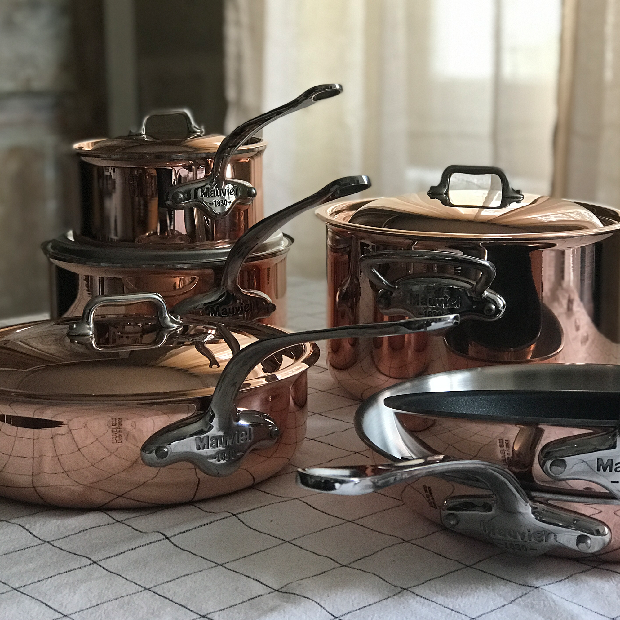 Mauviel M'6 S induction copper sauté pan with cast stainless steel handle and lid, 2.1-quart capacity, splayed curved design