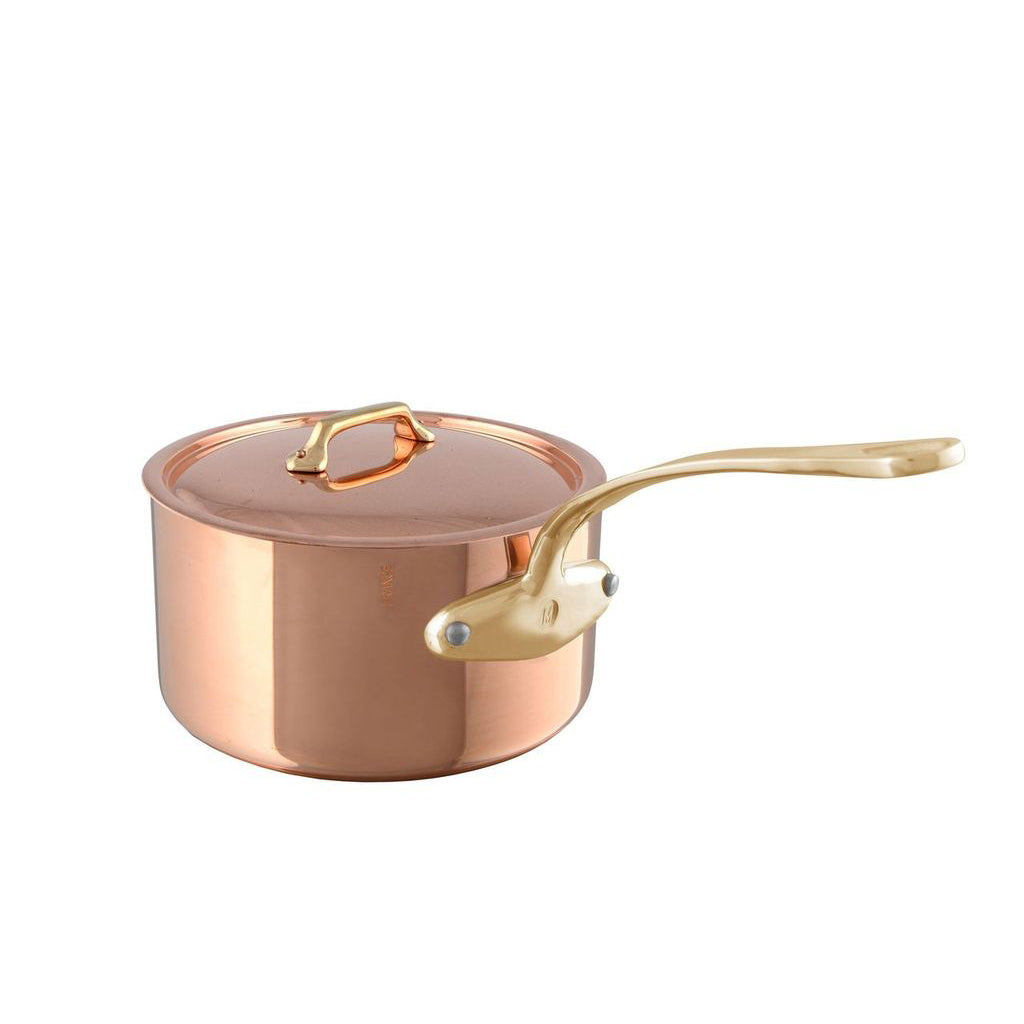 Mauviel M'Heritage M'200 B copper sauce pan with brass handle and lid, showcasing a polished copper exterior and sturdy handle.