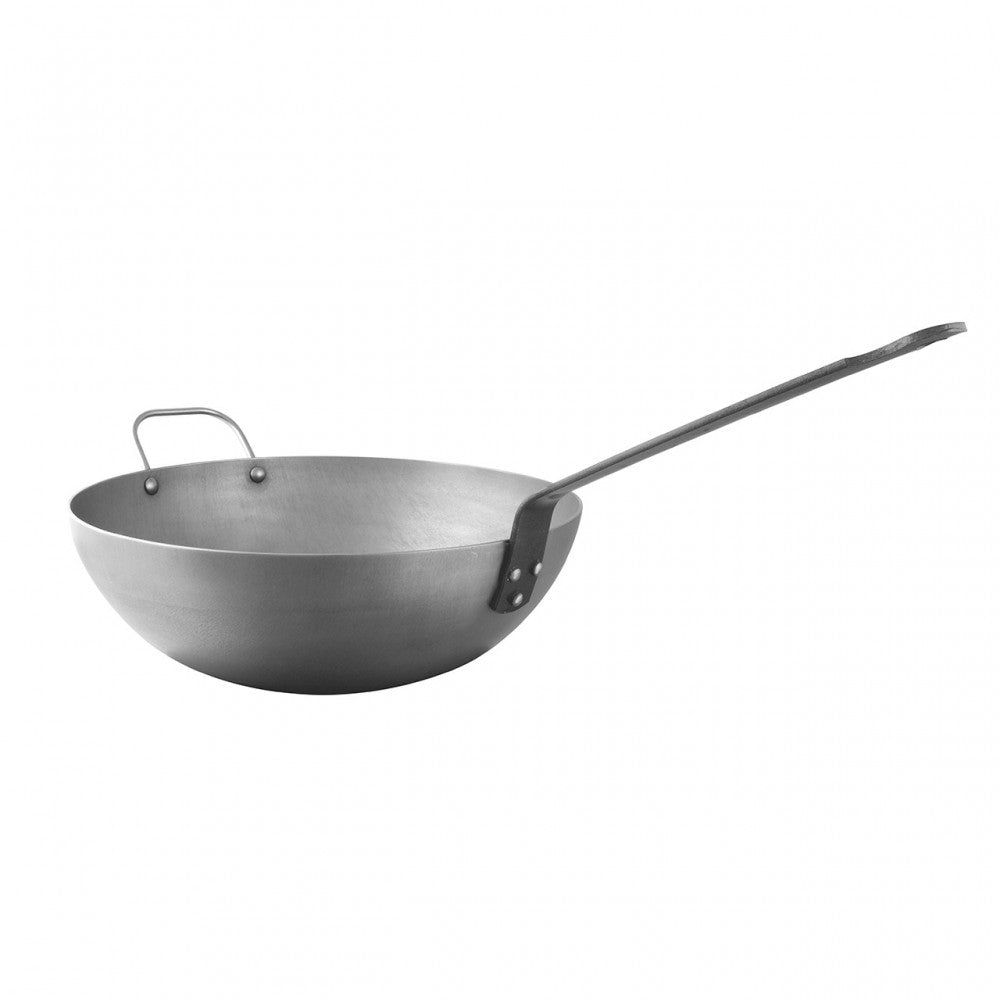 Mauviel M'STEEL black carbon steel wok with iron handle, 11.8-inch diameter, showing smooth, blackened cooking surface.