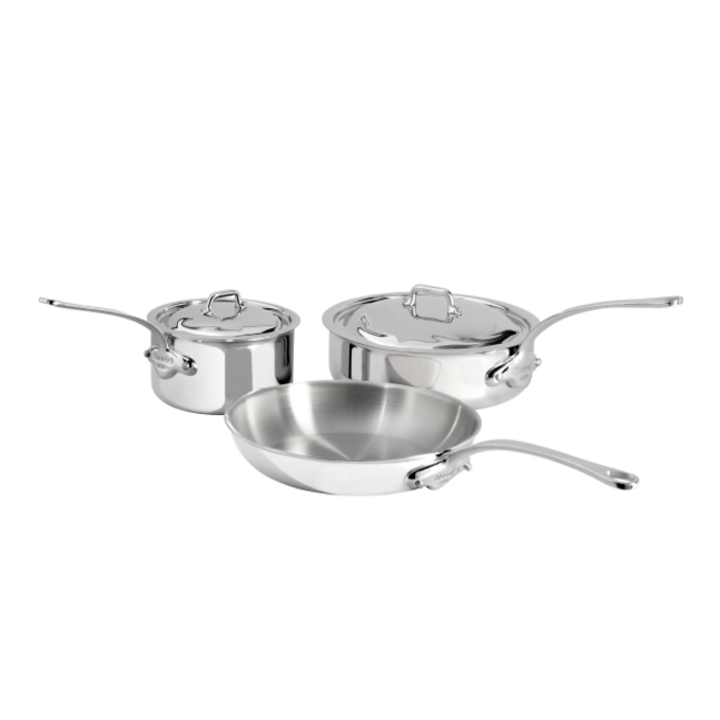 Mauviel M'COOK 5-piece cookware set with 5-ply construction and cast stainless steel handles, shown in a kitchen setting.