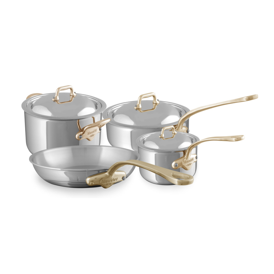 Mauviel M'COOK 7-piece cookware set with brass handles, featuring polished stainless steel pots and pans for professional cooking.